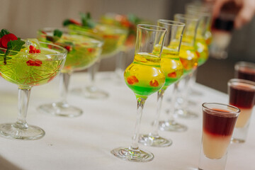 Welcome drink with cocktail glasses and drinks at an event. Alcoholic beverages at a wedding