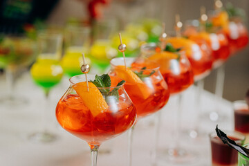 Welcome drink with cocktail glasses and drinks at an event. Alcoholic beverages at a wedding