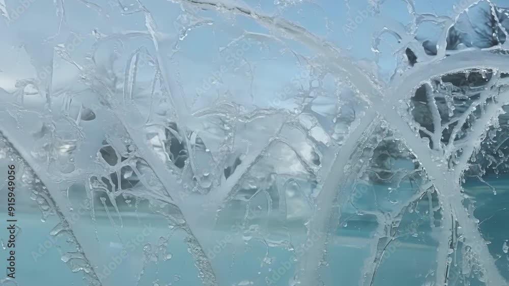 Poster In extreme closeup frosty swirls and loops create a stunning abstract design on a window resembling a frosty artwork.