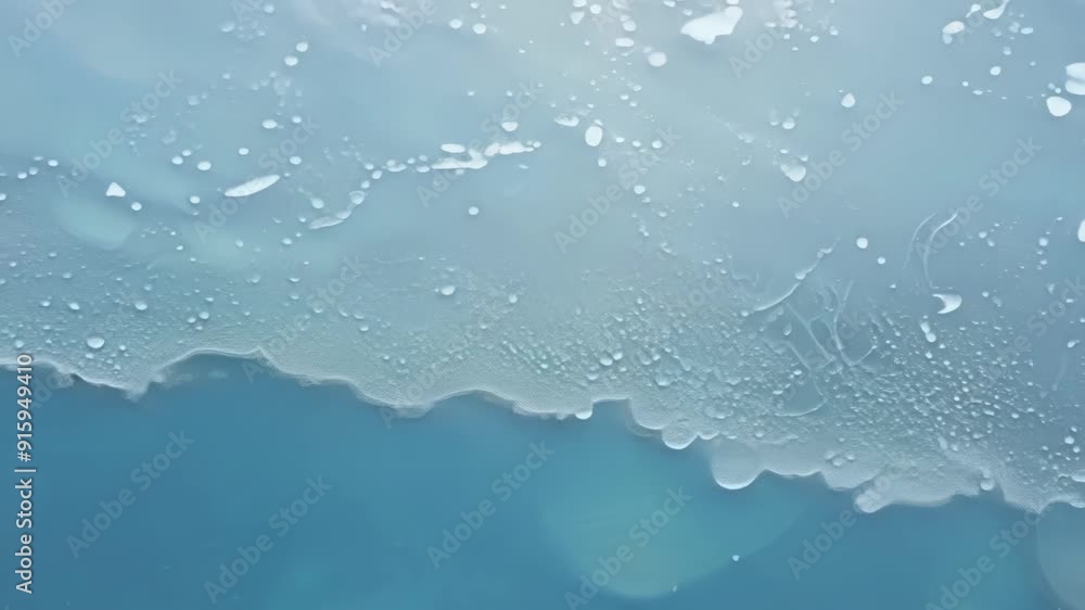 Aufkleber The camera captures the subtle movement of the water beneath the thin layer of ice creating a mesmerizing visual of natures everchanging dance.