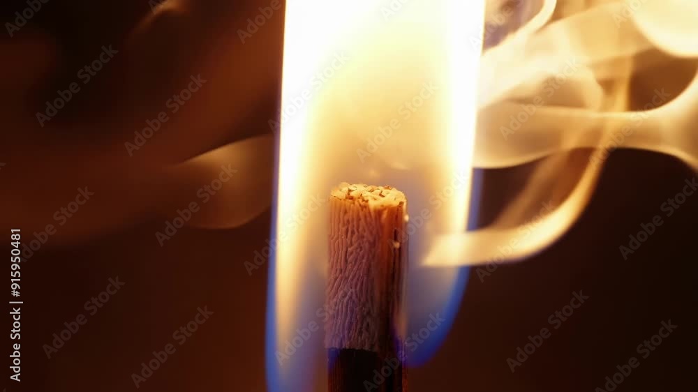 Poster As the matchstick begins to glow wisps of smoke rise and curl around it adding an atmospheric quality to the closeup shot.