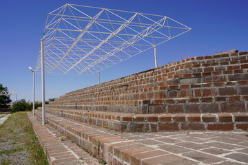 A Skeletal Canopy: The Framework of Ambition and the Steps of Progress under an Open Sky