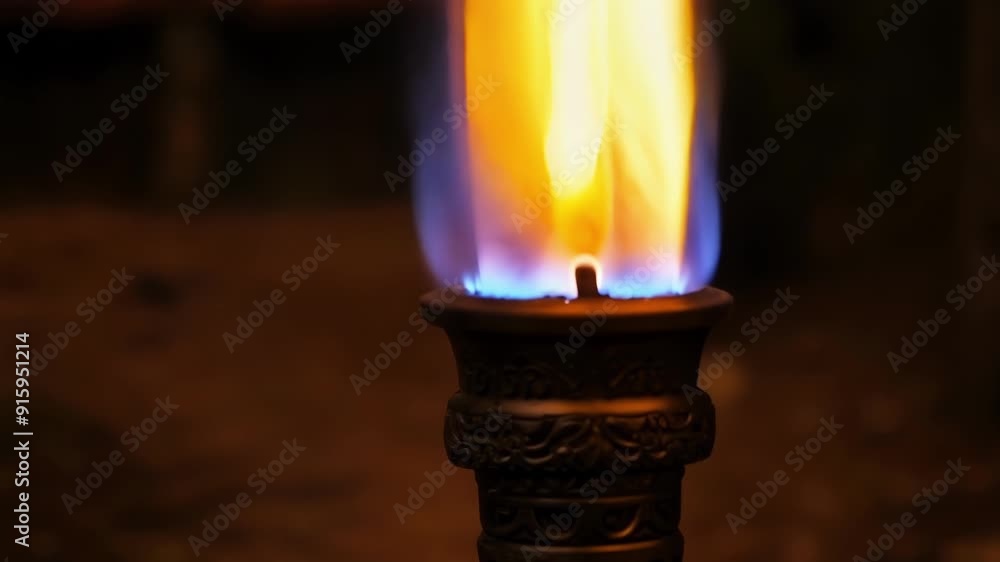 Poster A tight shot of a torch showcasing the controlled and powerful flame as it burns steadily without faltering.