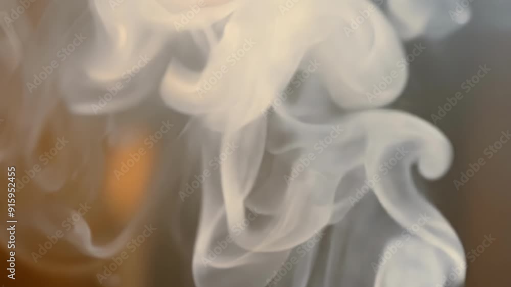 Poster closeup of candle smoke slowly dissipating into the air creating a soft and dreamy atmosphere.