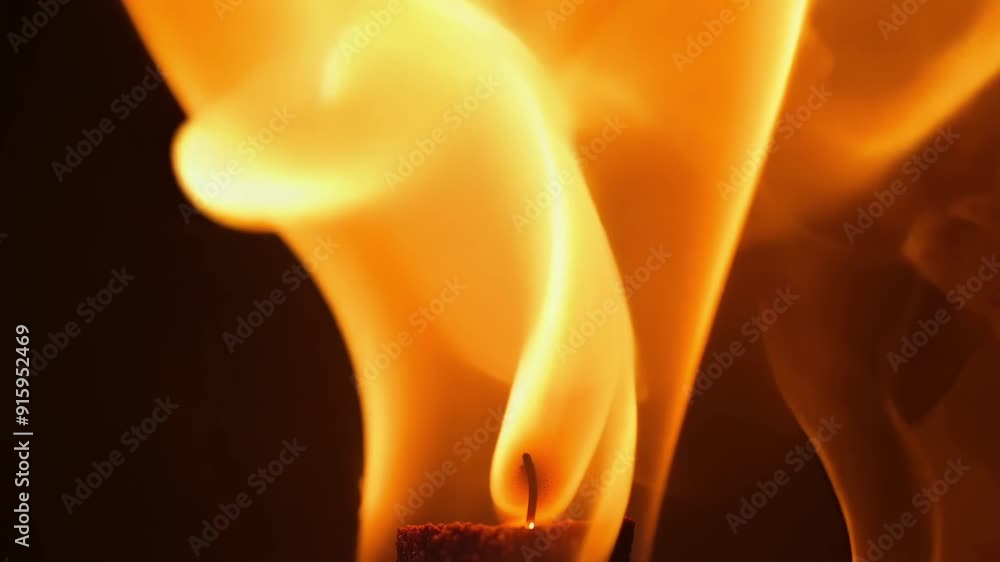 Poster Extreme closeup of a single piece of incense burning showing the orange glow and wispy tendrils of smoke emanating from it.