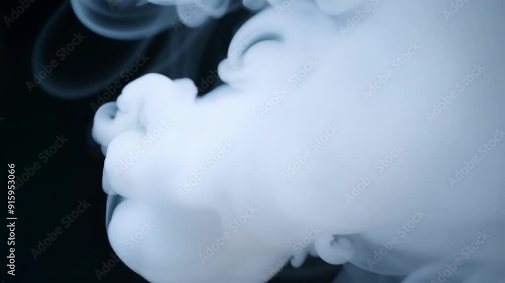 Aufkleber A series of small and delicate streams of vape intertwine and combine creating a mesmerizing display of white fluffy clouds.