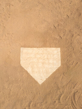 Top down view on home plate on a dirt baseball field