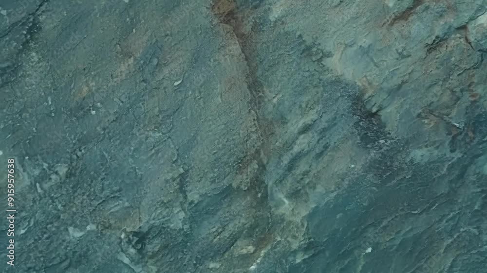 Aufkleber closeup of a single weathered rock its surface marked with deep grooves and small delicate cracks hi