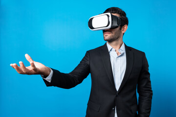 Professional smart business man holding something while wearing VR glasses. Caucasian project...