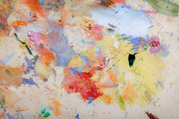 Colorful abstract texture. Smears of oil paint on an art palette. The concept of the modern school...