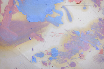 Colorful abstract texture. Smears of oil paint on an art palette. The concept of the modern school...