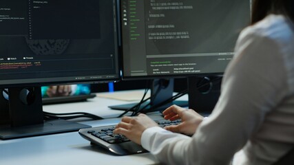Computer scientist in data center installing software on computer, troubleshooting issues, handheld camera shot. Close up of IT expert in server hub establishing performance benchmarks, camera A