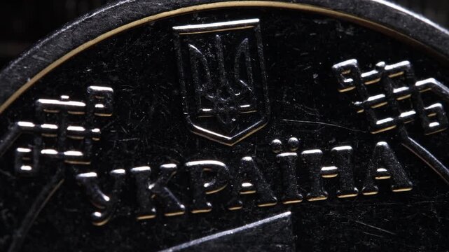 Coin one hryvnia, macro photography, Ukrainian money, text Ukraine, Ukrainian language, coat of arms of Ukraine