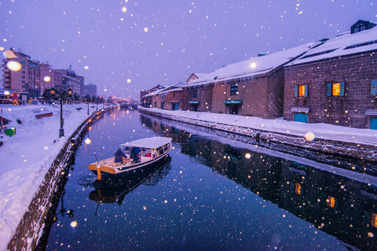Tourist boat sailing in a river in the snow, Hokkaido, Japan
