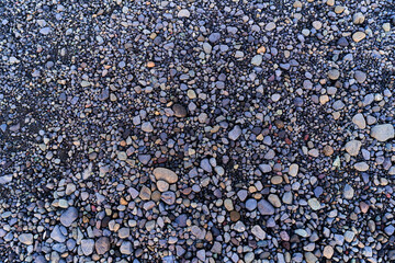 Background of small smooth blue grey gravel forming a textured ground