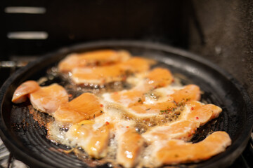 Sizzling salmon fillets cooking on a grill pan The perfect weeknight meal