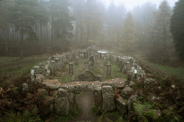 Fog in the British forest around fake Druid's temple