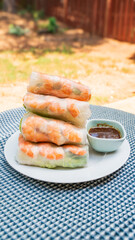 Goi cuon tom thit or Vietnamese summer rolls with shrimp. Cooked prawns or shrimp are wrapped in rice paper with fish mint leaves, bean sprouts, lettuces, mints, noodles. Dip in fermented fish sauces