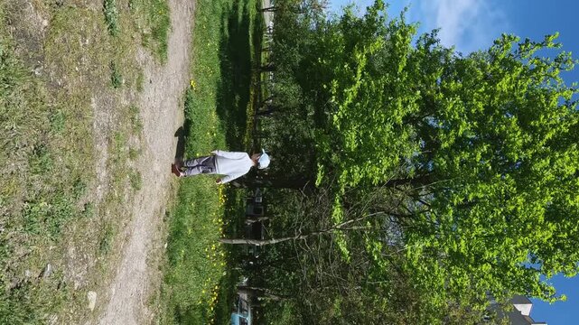 Vertical video - child and butterfly. Concepts of running, nature, ecology, world exploration, gross motor skills, sport, flight, dream, childhood, active lifestyle, laughter, summer, impressions