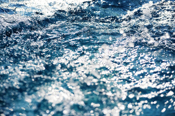 Sparkling light formed when sunlight reflects from water waves