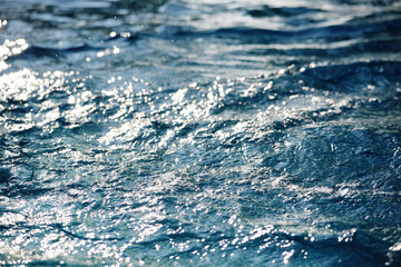 Sparkling light formed when sunlight reflects from water waves