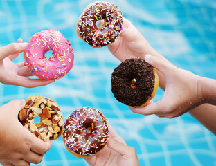 Having variety of glazing doughnut at the pool