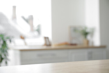 Wooden table in kitchen, closeup