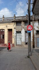 Old lady crossing the street in Cuba
