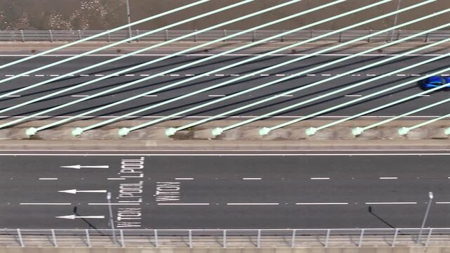 Vehicles Driving Along a Bridge Spanning the River Mersey in the UK