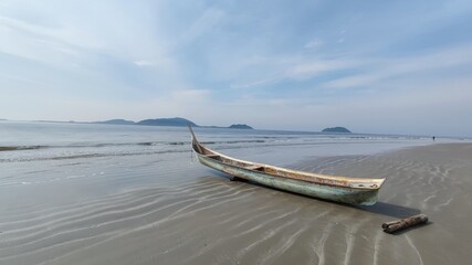 Small fishing boat on the beach.