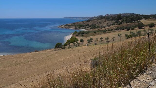 Pan over the south coast of Sicily in the summer