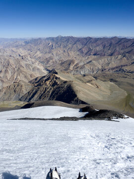 View from the summit of Kang Yatse II with a women's crampons in the foreground, Ladakh, India