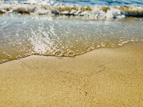 Close-up of sea surf on a sandy beach, Thassos, Aegean islands, Greece