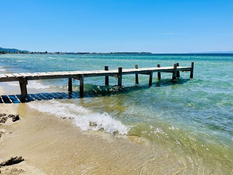 Fototapeta Wooden pier on a beach in summer, Thassos, Aegean islands, Greece