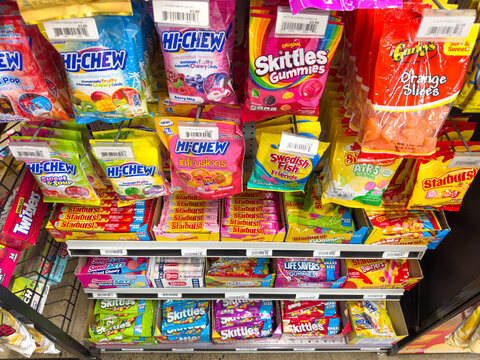 Variety of chewy candies on display inside a Kwik Mart.