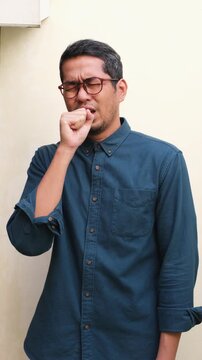 Adult asian man got bad cough and sore throat