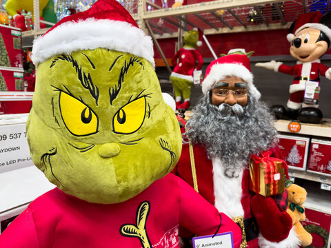 Christmas Holiday Display Featuring the Grinch and Santa Figures

