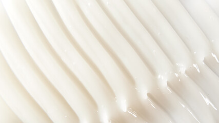 Close-up texture of skin and lotion, showcasing intricate details for use in design projects,...