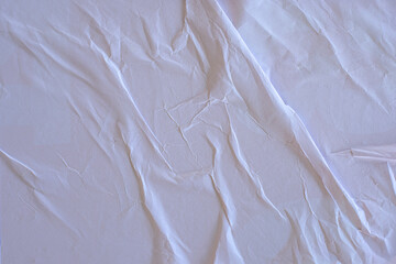 white crumpled and creased glued wrinkled paper poster texture background