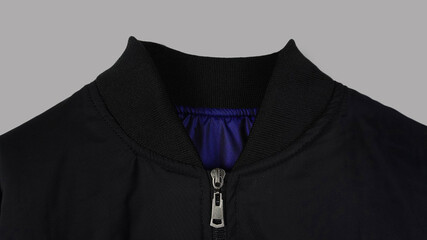 black bomber jacket collar detail on gray background