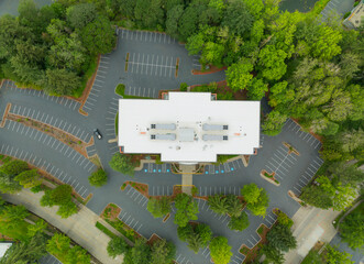 A parking lot with a large building in the middle