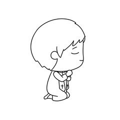 A young boy is kneeling down and holding a cross