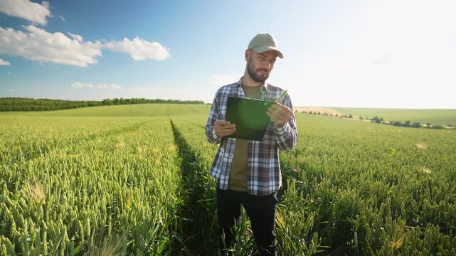 A Farmer Using Advanced Technology in a Vast Green Field for Better Crop Management and Growth