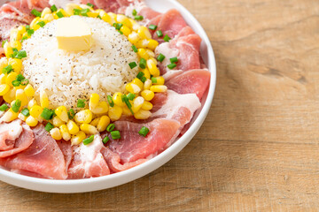 fresh pork raw sliced with rice and corn on plate and ready to cook