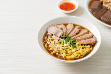 egg noodles with stewed duck in brown soup