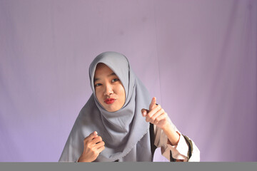 Portrait of a confident Asian woman facing the camera on an isolated background