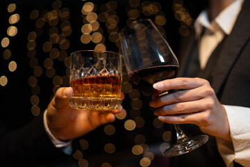 Barwoman pouring whiskey whiskey glass..