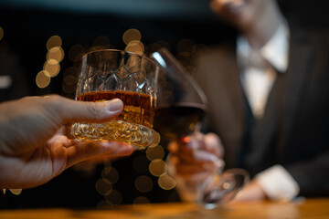 Barwoman pouring whiskey whiskey glass..