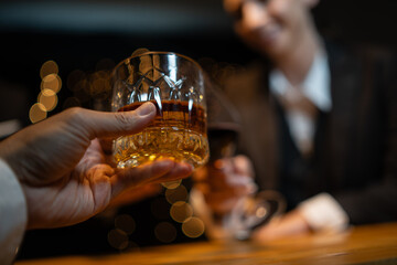 Barwoman pouring whiskey whiskey glass..