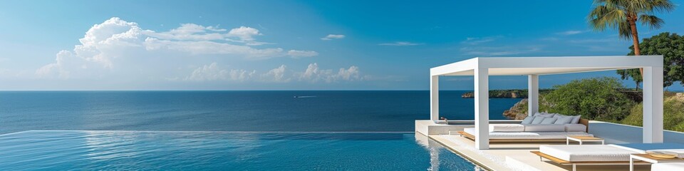 Fototapeta premium Luxurious oceanfront infinity pool with a white canopy, overlooking the blue sea and sky, perfect for a serene and relaxing getaway.